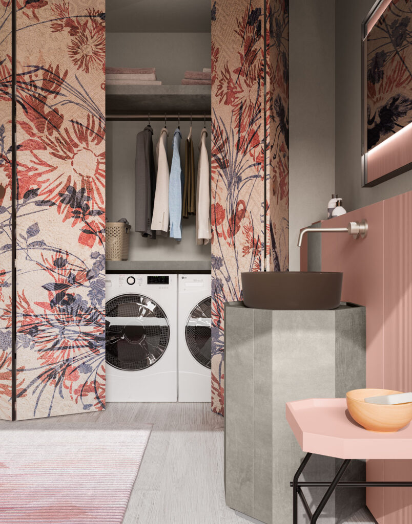 Armadio lavanderia con ante floreali in bagno rosa
