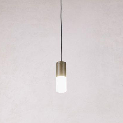 Lampada CREO con corpo cilindrico bronzo acceso