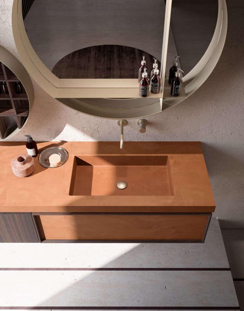 Lavabo integrato in top materico color terracotta